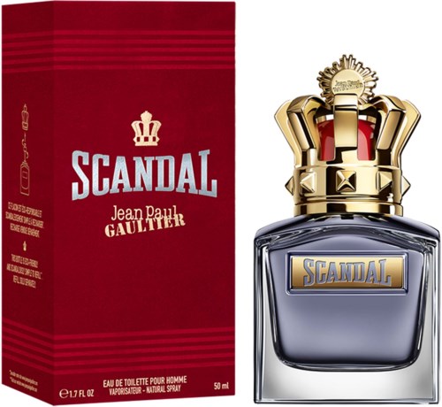 Een parfumfles met een gouden kroonkap en een rood doosje met witte en gouden tekst voor Scandal door Jean Paul Gaultier.