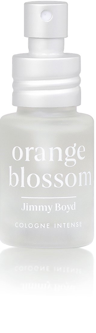 Een witte sprayfles met 'orange blossom' van Jimmy Boyd, gebruikt voor cologne, met spraydop en eenvoudig ontwerp.