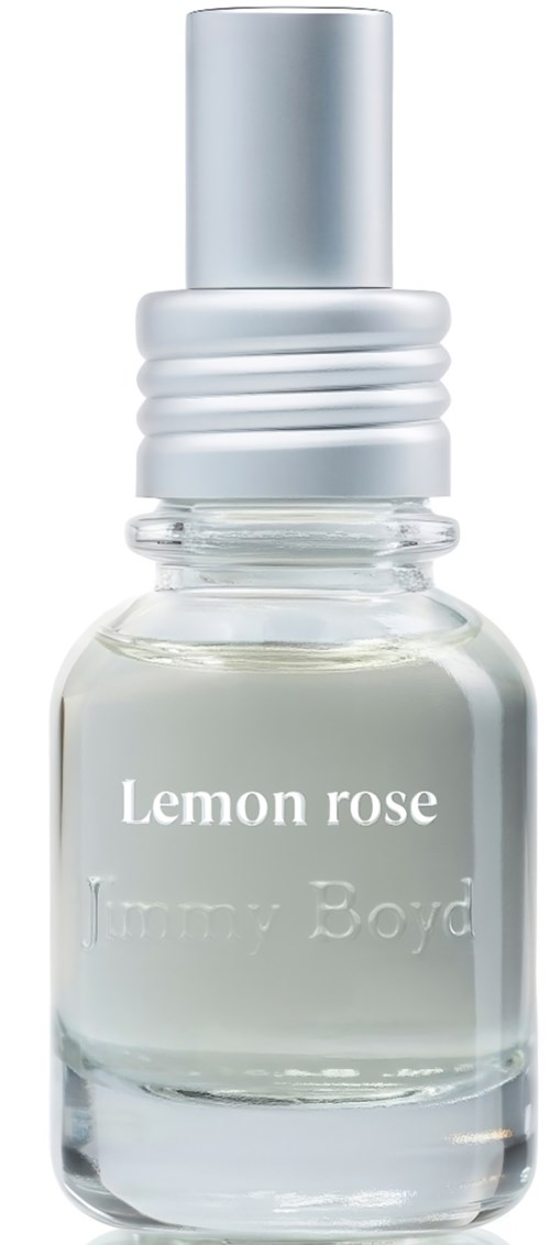 Een klein doorzichtig flesje met een zilveren dop, gelabeld Lemon Rose door Jimmy Boyd, waarschijnlijk geur- of oliënflacon.