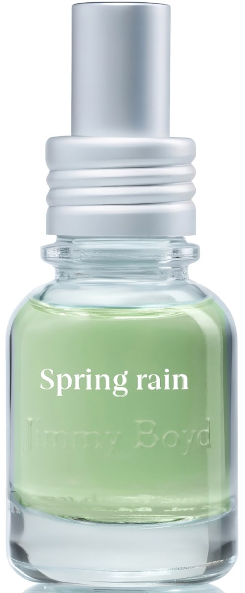 A small glass bottle with pale green liquid perfume and a silver cap labeled Spring rain.