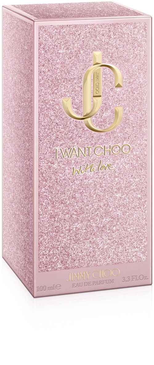 Roze glitterdoos met goudlogo en tekst voor parfum genaamd 'I WANT CHOO'.