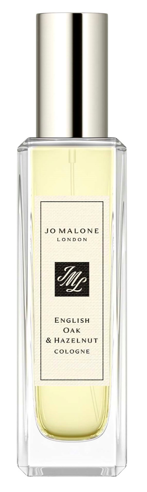 En klar glasflaska med silverlockr innehåller Jo Malone London cologne med lime, ek och hasselnöt doft.
