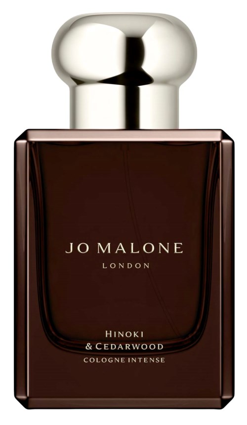 Tumma ruskea hajuvesipullo hopeisella korkilla, nimeltä 'Jo Malone London Hinoki & Cedarwood.'