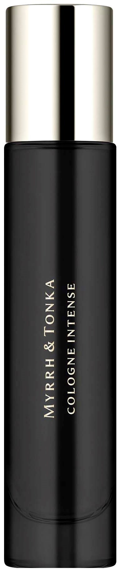 Musta sylinteripitoinen pullo hopealla kannella ja merkinnällä 'MYRRH & TONKA COLOGNE INTENSE'.