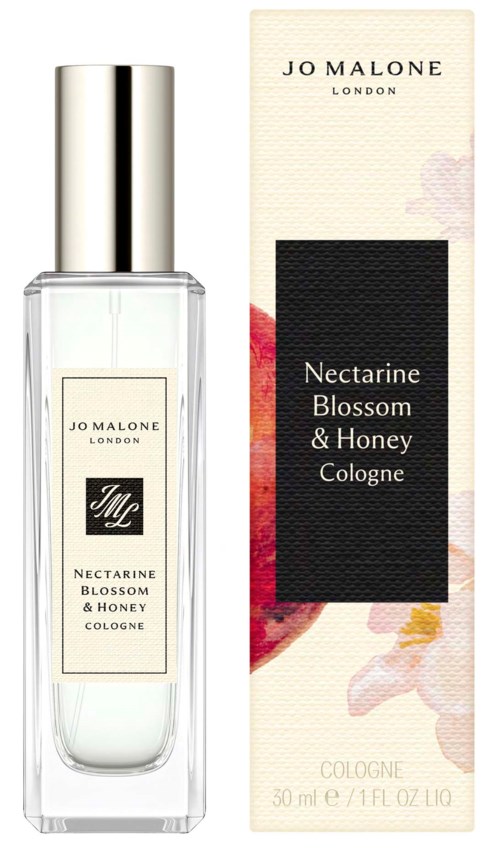 En tydlig parfyllflaska med silverlock och en förpackning med blommor och doftnamnet Nectarine Blossom & Honey.