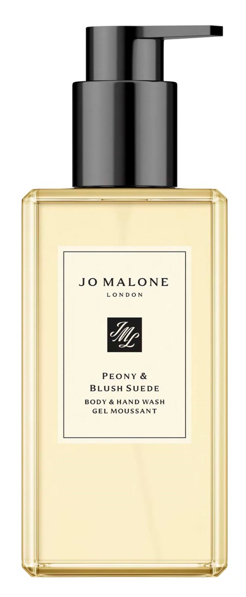 En gjennomsiktig flaske med Jo Malone Peony & Blush Suede kropp og håndsåpe med svart pumpelokk.