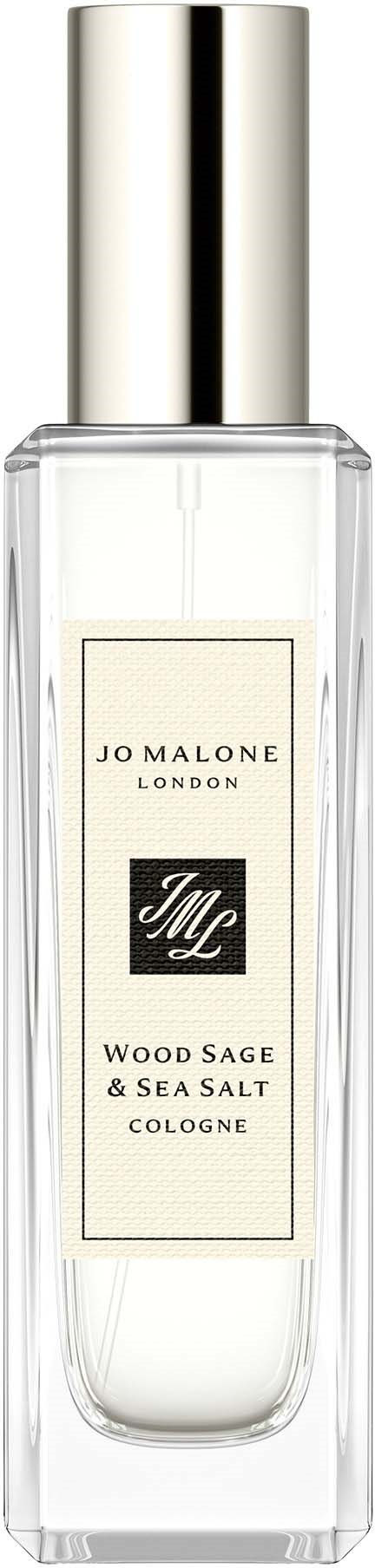 Läpinäkyvä lasipullo, jossa on hopeinen korkki ja merkintä 'Jo Malone London' ja 'Wood Sage & Sea Salt Cologne.'