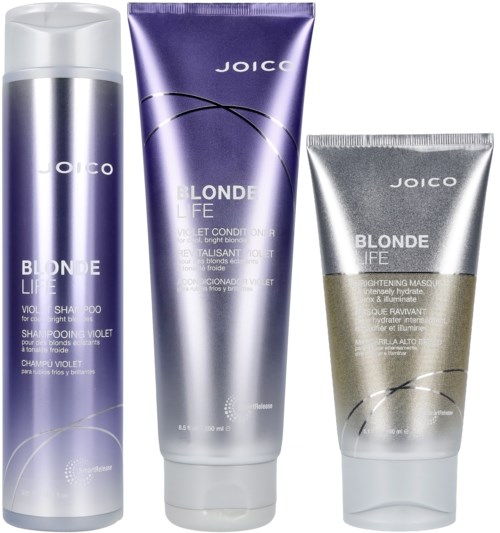 Drei Haarpflegeprodukte in lila, silber und beige Tuben und Flaschen aus der Joico Blonde Life Reihe.