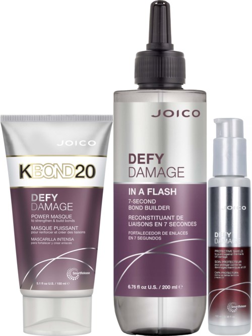 Drie Joico haarproducten: een masker, een sprayfles en een kleine pompfles, allemaal voor haarherstel en bescherming.