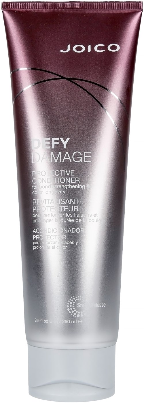 Eine Tube Joico Defy Damage Protective Conditioner in Schwarz, Pink und Silber mit Produktdetails auf der Vorderseite.
