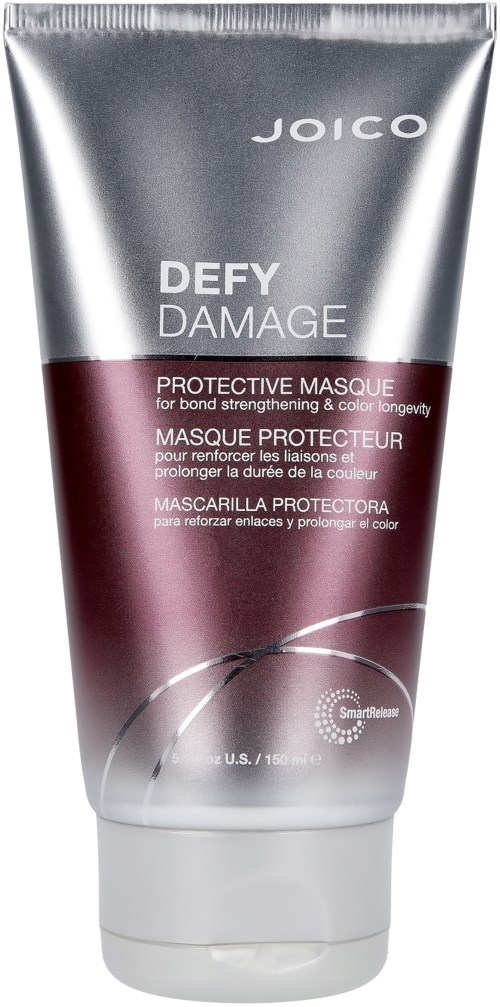 Een zilveren en bordeauxkleurige tube van Joico Defy Damage beschermende haarmasker, met tekst in Engels en Frans, en een klein pictogram.