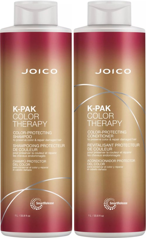 Kaksi Joico K-Pak Color Therapy -shampoopulloa ja hoitoainepulloa beige- ja pinkkiin pakkaukseen ja valkoisiin korkkeihin.