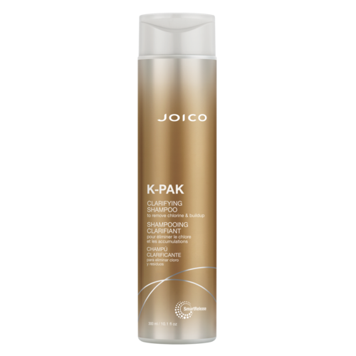 Een lange, goudkleurige en witte shampoefles met het label Joico K-Pak Clarifying Shampoo.
