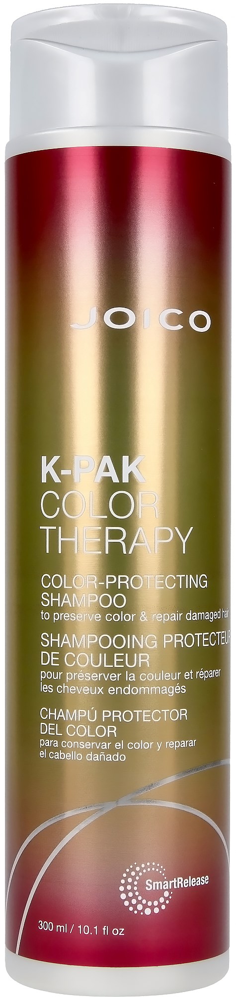 A tall, cylindrical bottle of K-PAK color therapy shampoo with a gradient of red, green, and gold, white cap, and brand name.