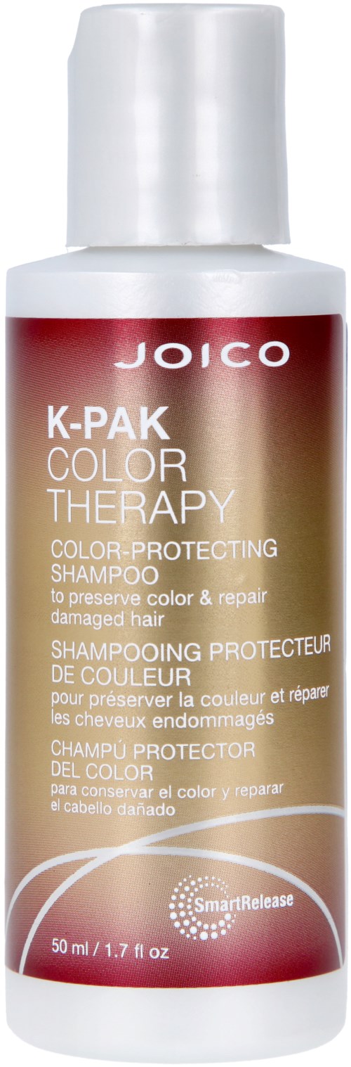 A white bottle of Joico K-Pak Color Therapy Shampoo for damaged hair protection.