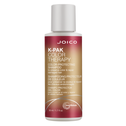 A bottle of Joico K-Pak Color Therapy shampoo, alerting to protect and repair color-treated or damaged hair.