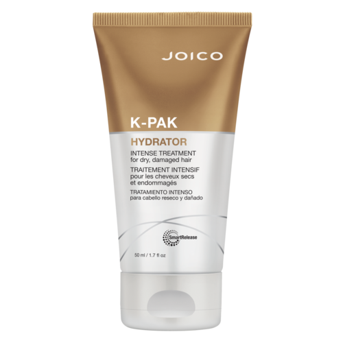 Een tube Joico K-Pak Hydrator voor droog, beschadigd haar met oranje en witte label.
