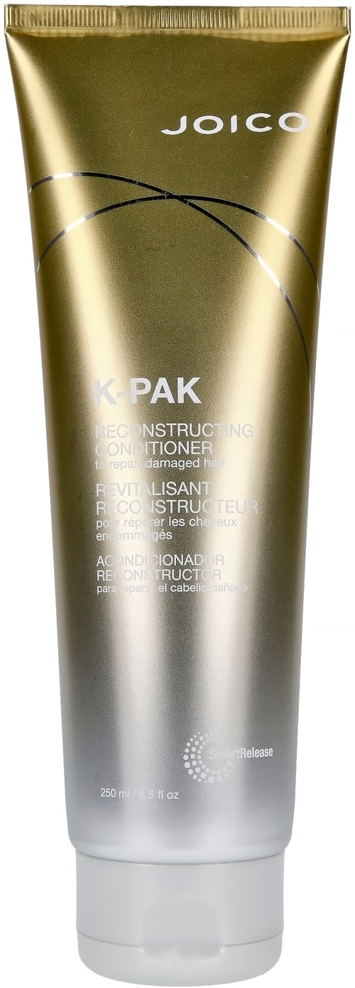 Gold and silver tube of Joico K-Pak reconstructing conditioner. Text about repair for damaged hair on the tube.