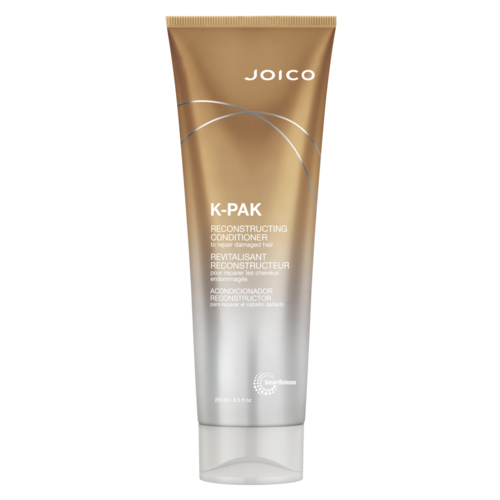 A brown and silver tube labeled 'Joico K-Pak Reconstructing Conditioner' for damaged hair repair.
