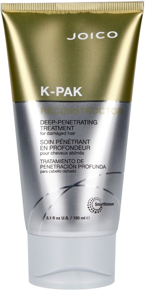 Een tube van Joico K-Pak diepe verzorging voor beschadigd haar met goud- en zilverkleurig ontwerp.