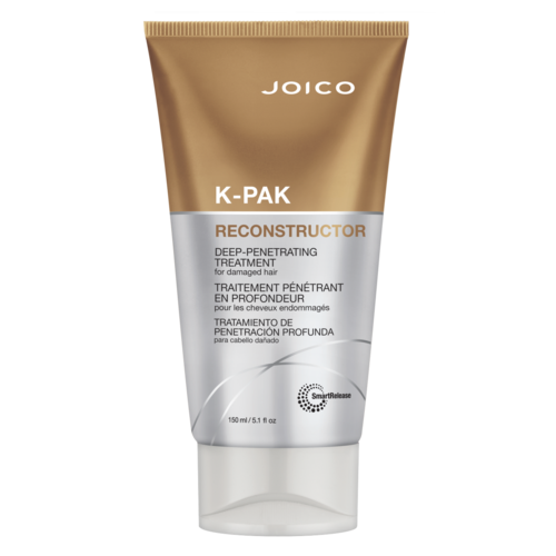 Bruine en zilveren tube met tekst voor haarbehandeling, merk Joico, genaamd K-Pak, diep-penetrerende behandeling voor beschadigd haar.