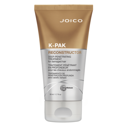 Beige- ja hopea-pakkaukseen merkitty Joico K-Pak Reconstructor hoitotuote vaurioituneeseen hiukseen.