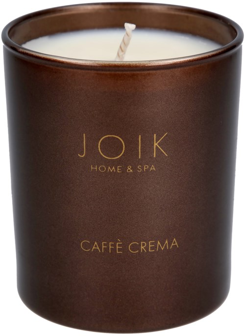A dark brown candle jar with gold text, labeled 'JOIK Home & Spa' and 'Caffè Crema', with a white candle inside.