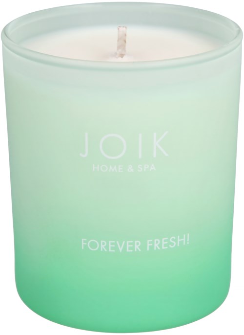 A mint green candle with the text "JOIK HOME & SPA" and "FOREVER FRESH!" on it.