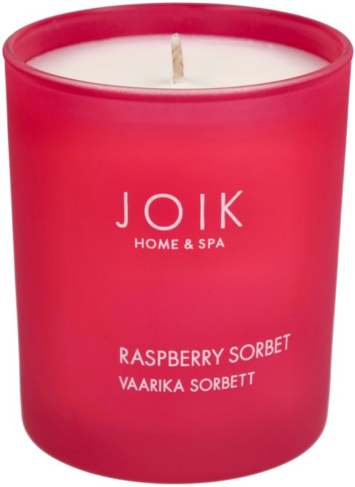 Pink candle with white wax and a small wick. The label says 'JOIK HOME & SPA', 'Raspberry Sorbet'.