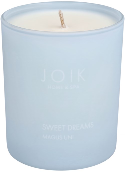 A white candle in a light blue jar labeled 'Joik' with scent 'Sweet Dreams.'