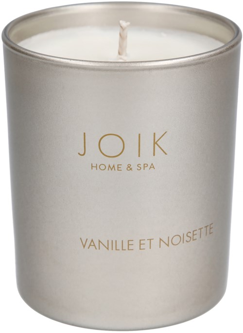 A white scented candle with a silver top and the words 'JOIK HOME & SPA Vanilla et Noisette' on the label.