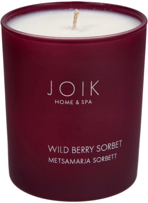 A dark red candle with a white wick, labeled 'JOIK Home & Spa' and 'Wild Berry Sorbet.'