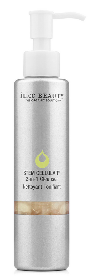 En lång, silver flaska med pump, märkt Juice Beauty stamcellrengöring med en gul dropplogotyp.