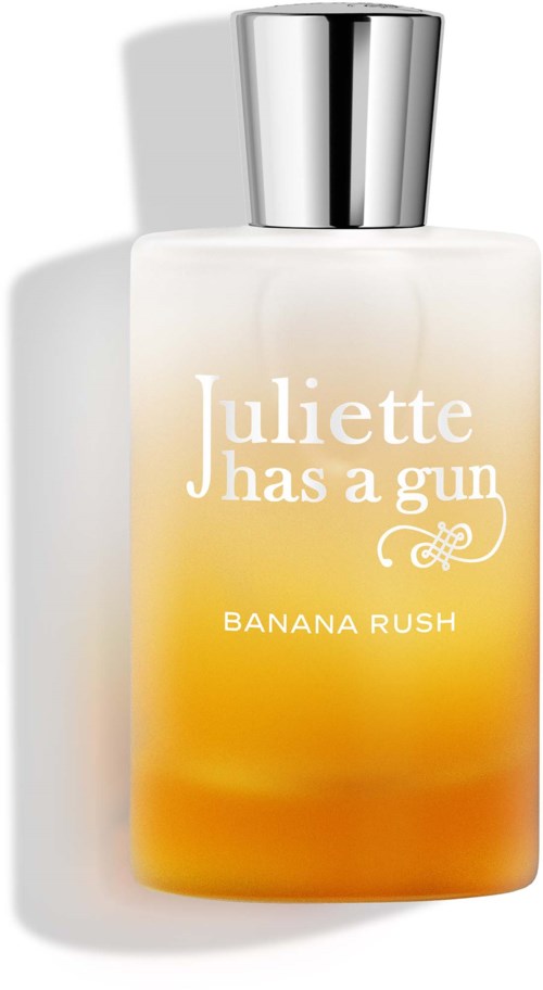 A perfume bottle labeled Juliette Has a Gun Banana Rush, with a gradient yellow-orange design and a silver cap.