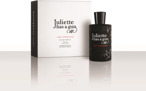 A perfume bottle and box with the label 'Juliette has a gun' and 'Lady Vengeance' on a reflective surface.
