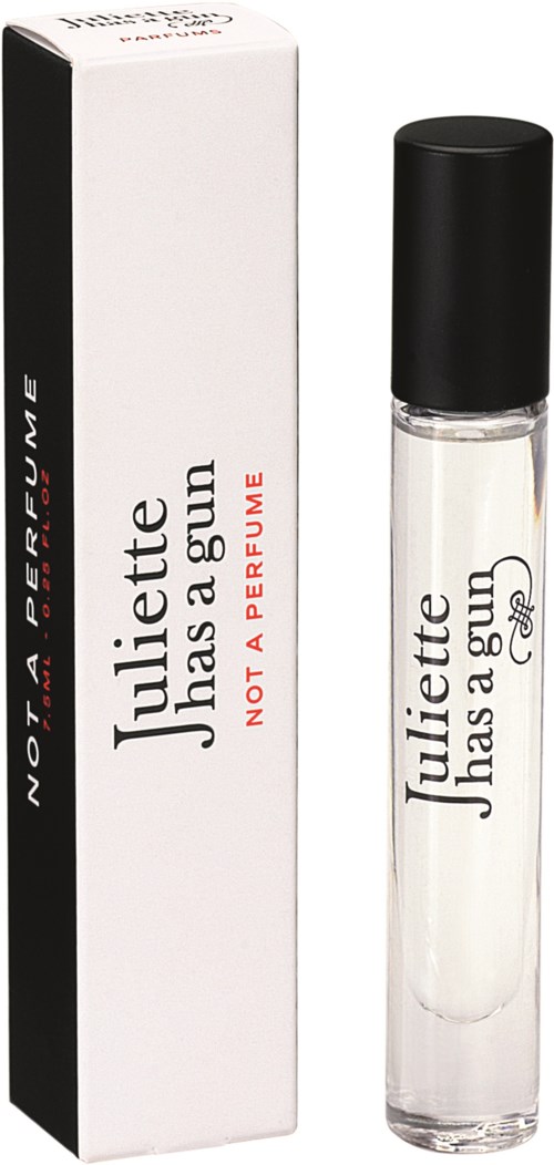 A perfume roll-on bottle with a white box, says 'Juliette has a gun,' and 'NOT A PERFUME,' with a black cap.