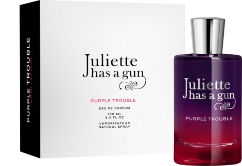 Purple and black box next to a purple and red perfume bottle with silver cap.