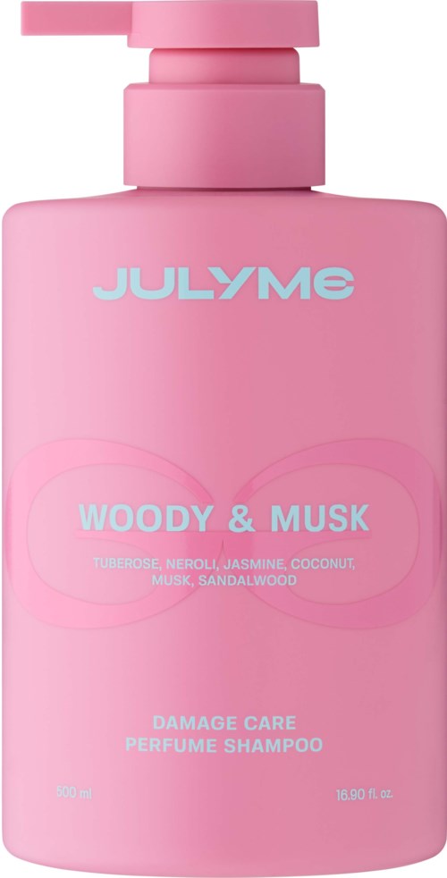 Pink shampoo bottle labeled Woody & Musk with scent notes of jasmine, coconut, and sandalwood.