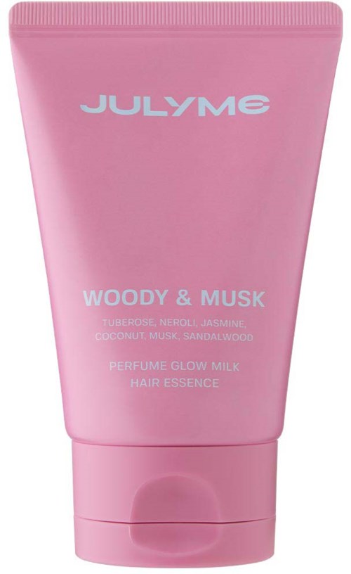A pink tube labeled JULYME Woody & Musk, containing perfume glow milk hair essence with coconut, musk, and sandalwood.