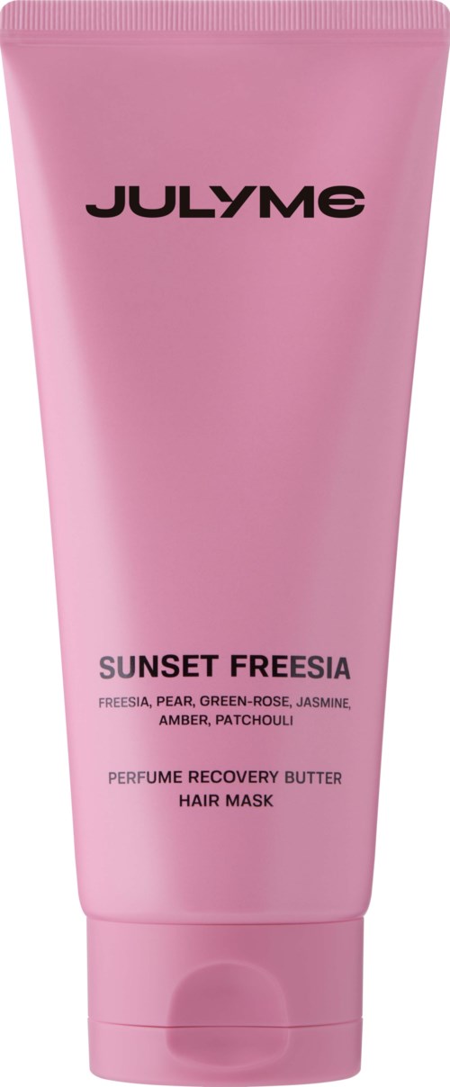 Pink tube of JLYME Sunset Freesia hair mask with scent notes of freesia, pear, rose, jasmine, amber, and patchouli.