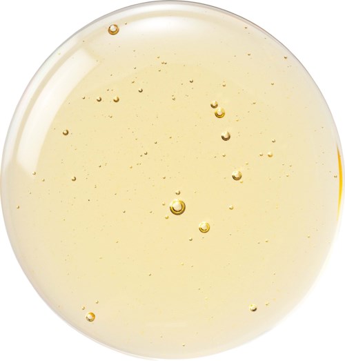 Een heldere vloeistof met kleine belletjes, in een ronde container. Het lijkt op een glas frisdrank of bruisende drank.