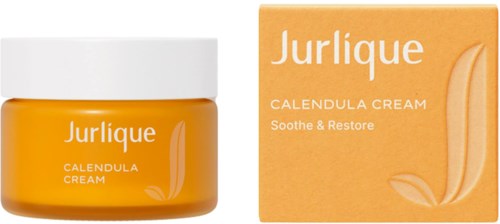En krukke og eske med Jurlique Calendula krem, gul farge, med hvit topper og tekst.