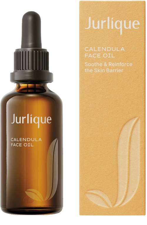Een bruin druppelflesje en een beige doos van Jurlique Calendula Face Oil, bedoeld om de huidbarrière te kalmeren en te versterken.