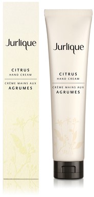 A tube of Jurlique Citrus Hand Cream and its box with a light citrus and floral design on white background.