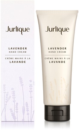 En tube med Jurlique Lavendel håndkrem med matchende eske, med lavendelillustrasjoner og enkel design.