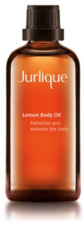 Kleine braune Flasche mit schwarzem Deckel, beschriftet mit 'Jurlique Lemon Body Oil'.