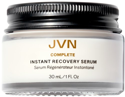 Ein Glas mit JVN Complete Instant Recovery Serum mit schwarzem Deckel und weißem Behälter.