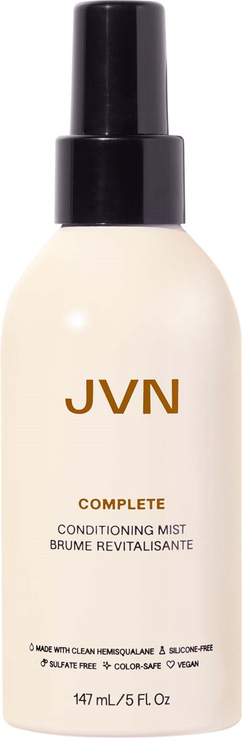 Eine weiße Sprühflasche mit schwarzem Sprühkopf, mit JVN Complete Conditioning Mist etiketti, 147mL. Klare, einfache Gestaltung.