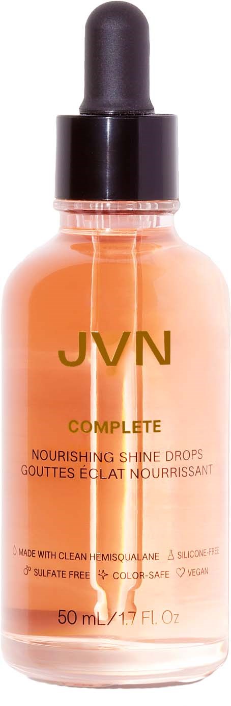 Eine pfirsichfarbene Flasche mit schwarzem Tropferdeckel, gekennzeichnet mit JVN Complete Nourishing Shine Drops, 50 ml.