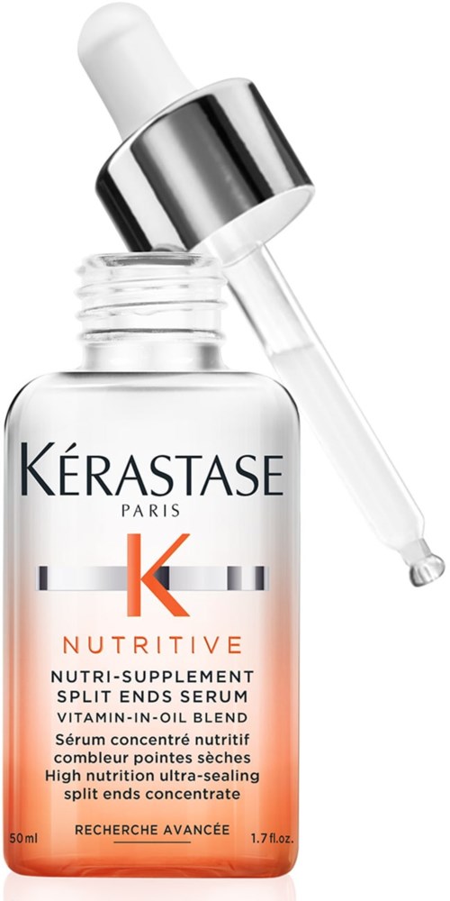 Een huidverzorgingsserumfles met pipet, gemerkt Kérastase Nutritive, oranje-wit ontwerp, 50 ml.
